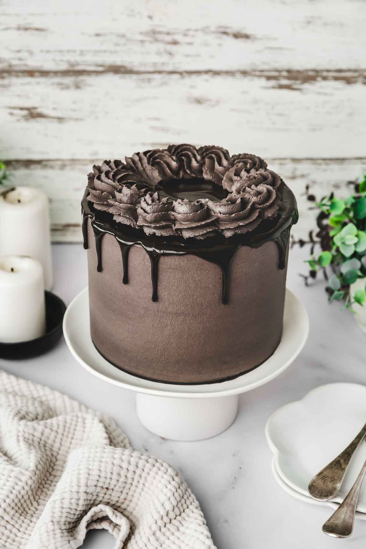 black chocolate cake on a cake stand