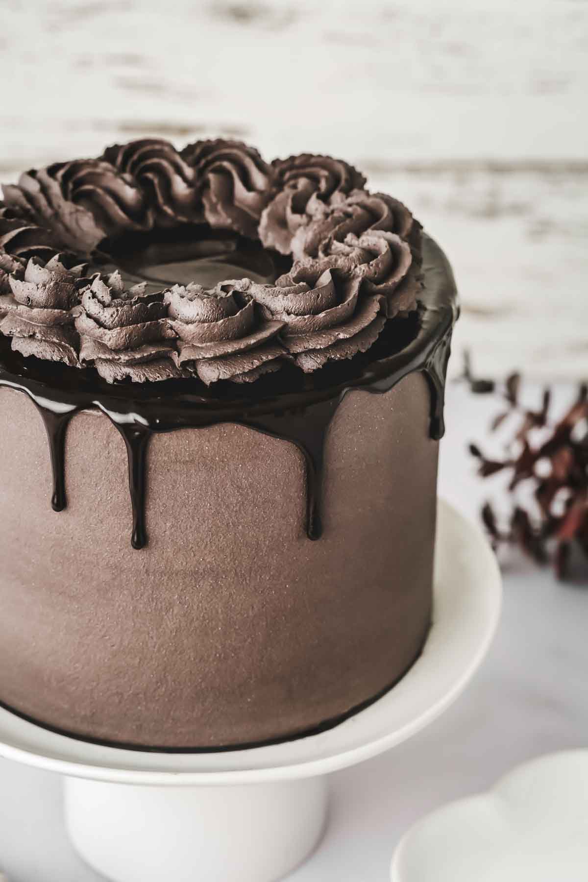 black coco cake on a cake stand
