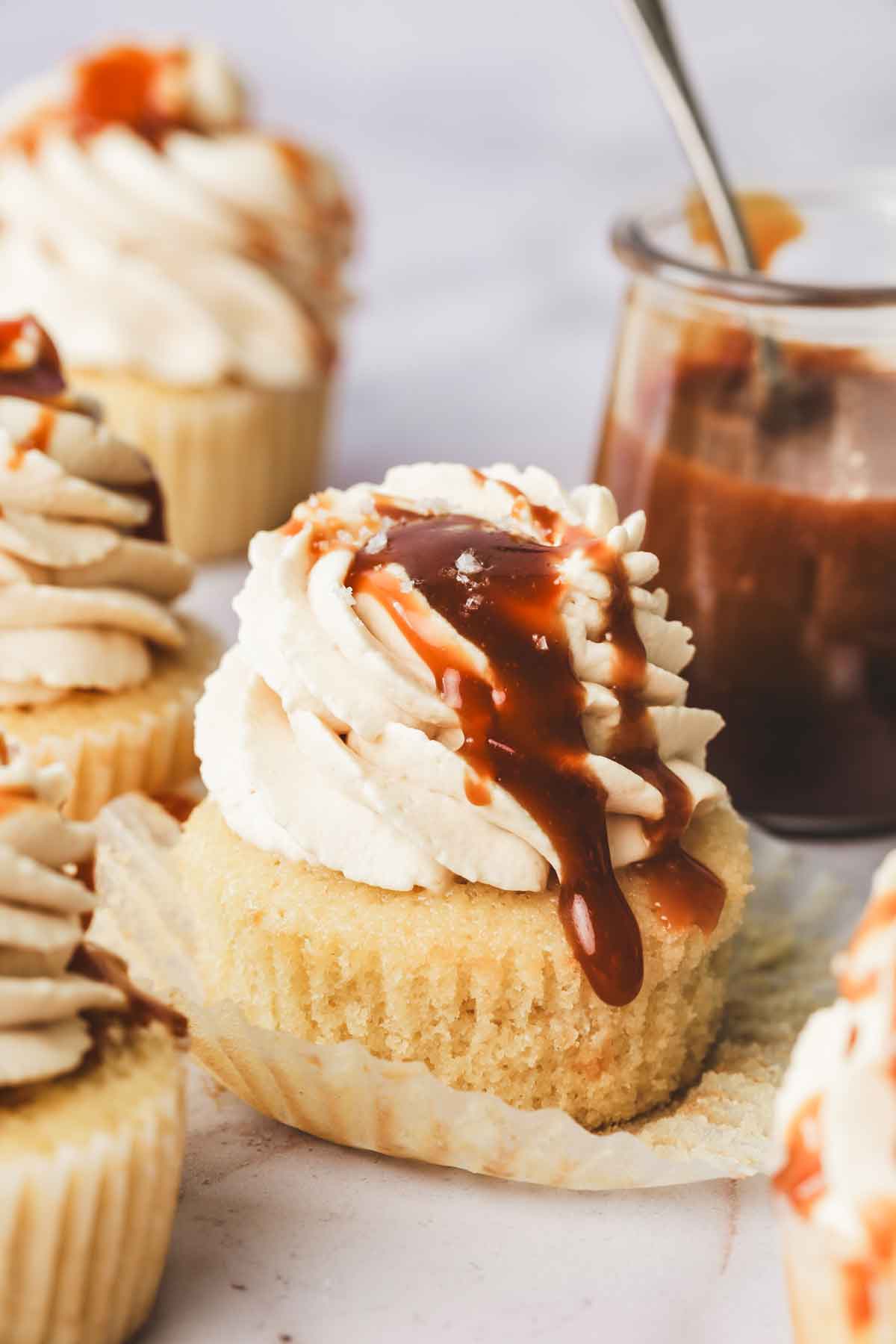 salted caramel filled cupcakes arranged on a table