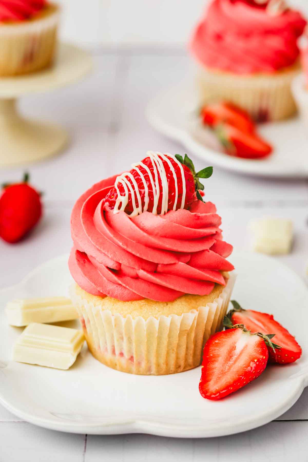 Strawberry ganache cupcakes on a table