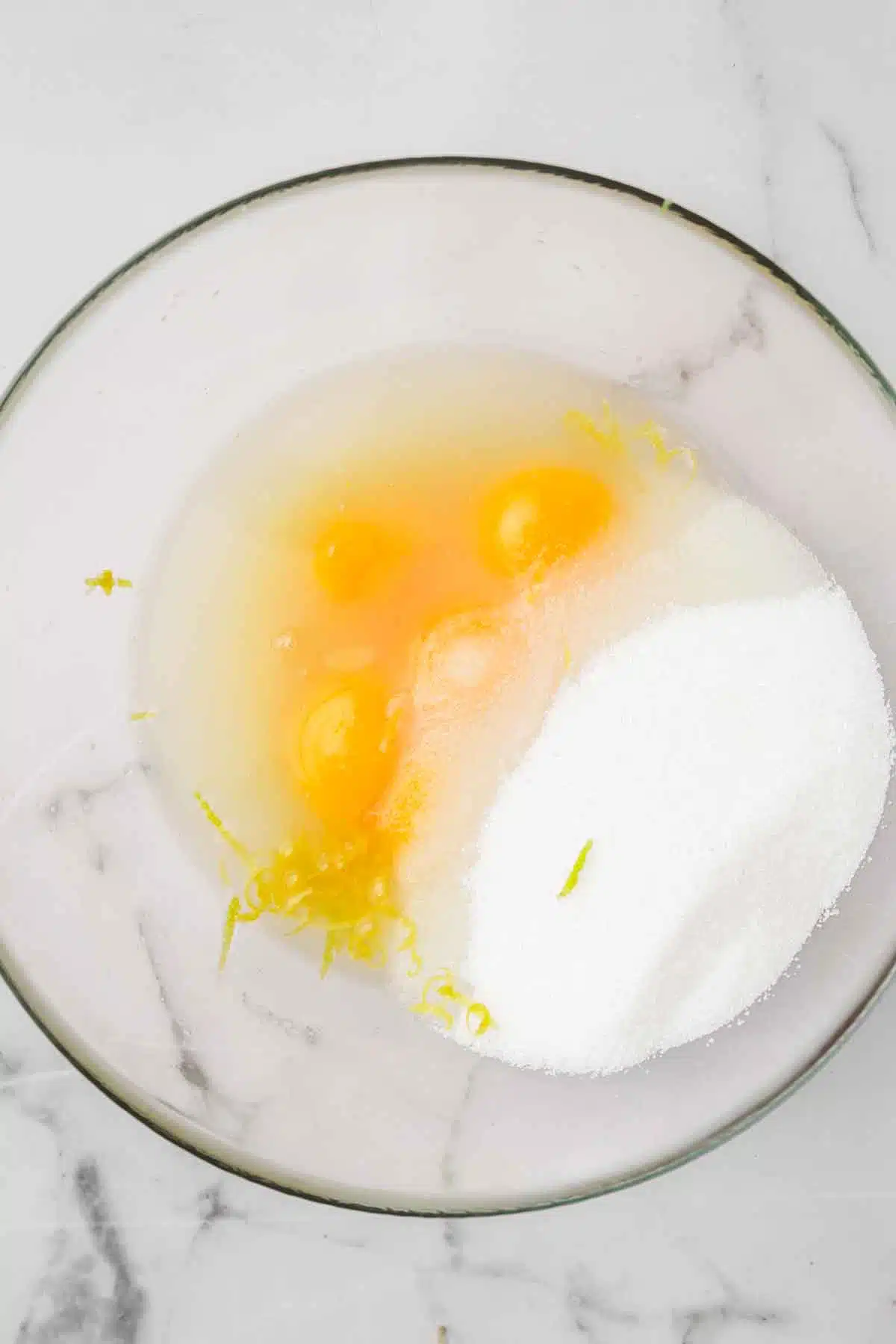 medium bowl with egg yolk and sugar