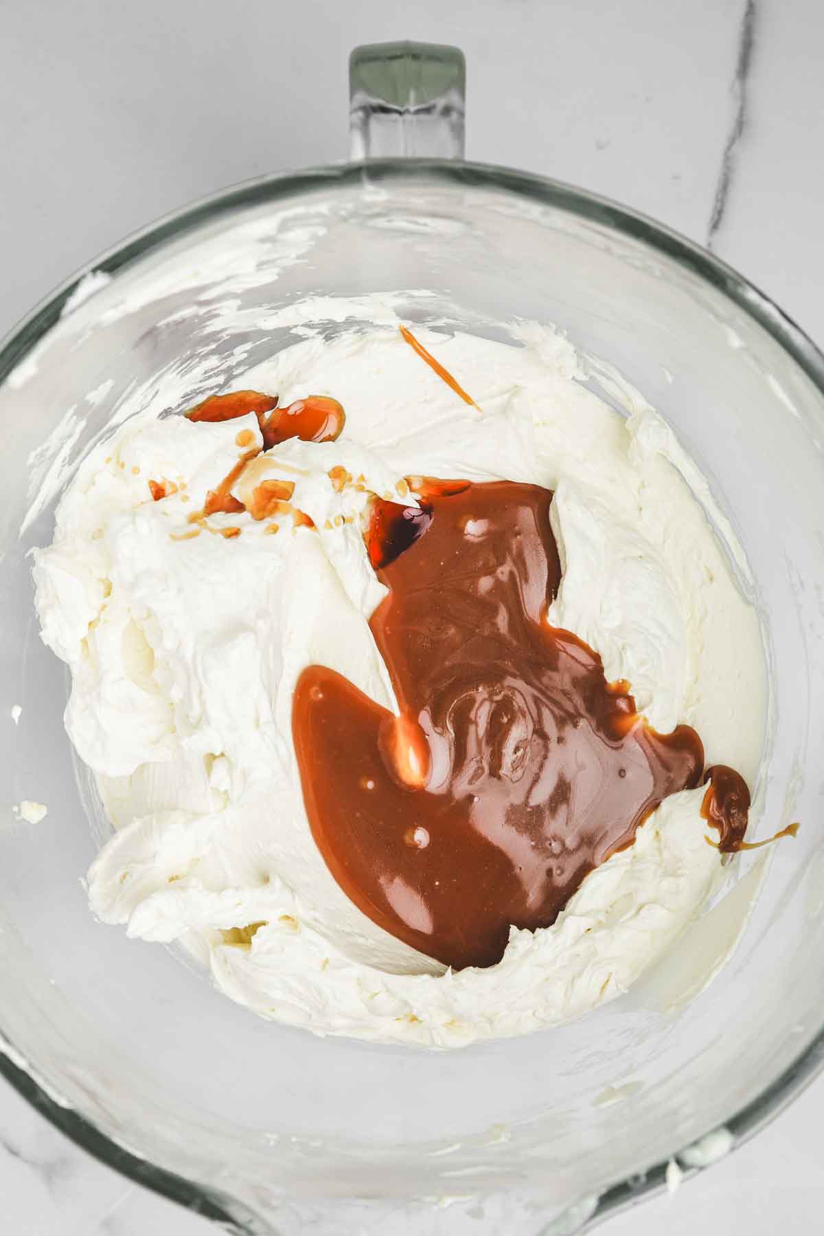 mixing bowl with salted caramel sauce and buttercream