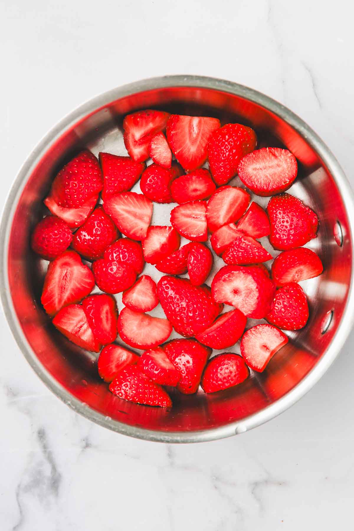 saucepan with fresh strawberries