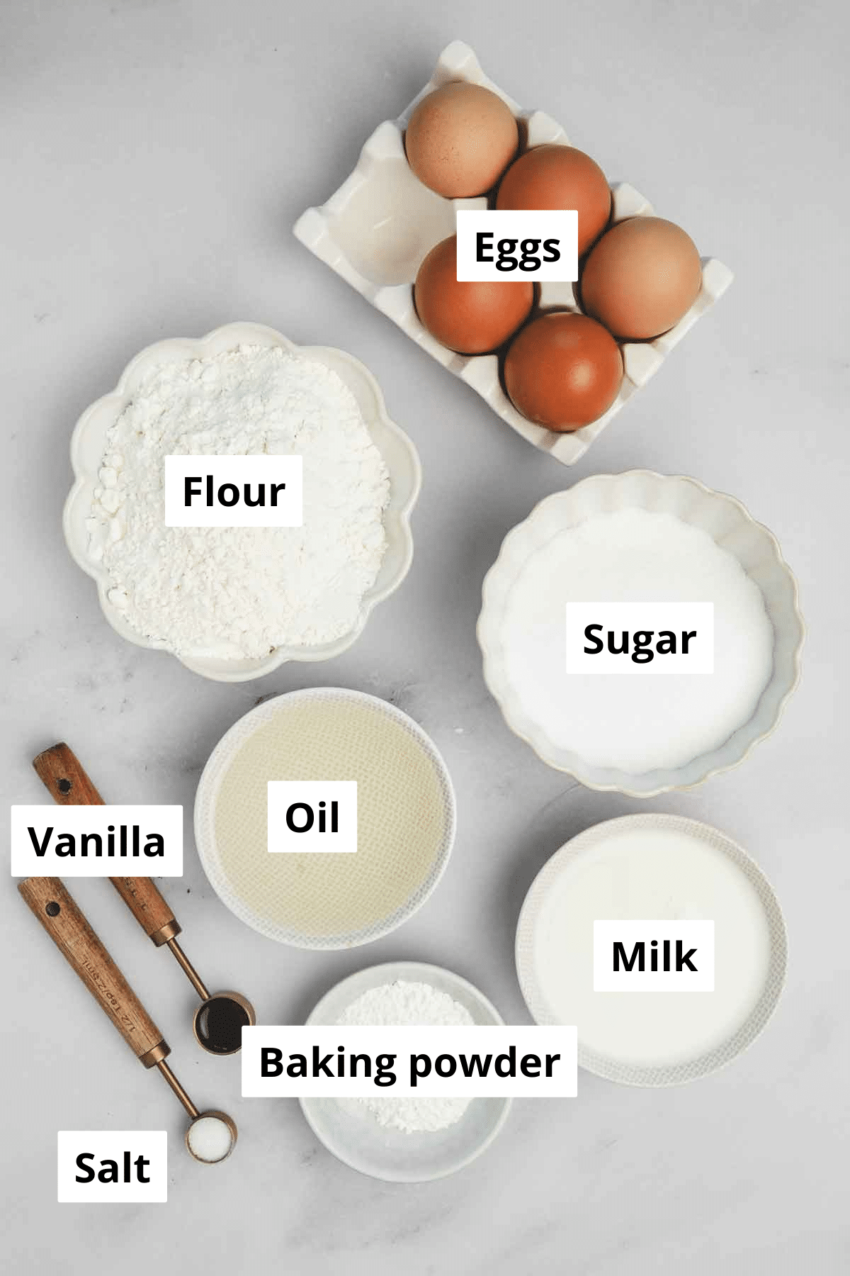 Cake flour, eggs, and sugar in bowls for chiffon sponge