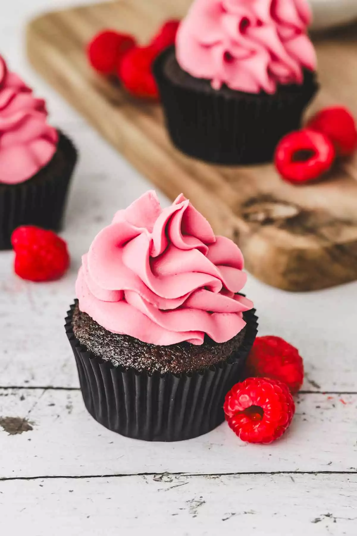 chocolate cupcakes with raspberry ganache topping