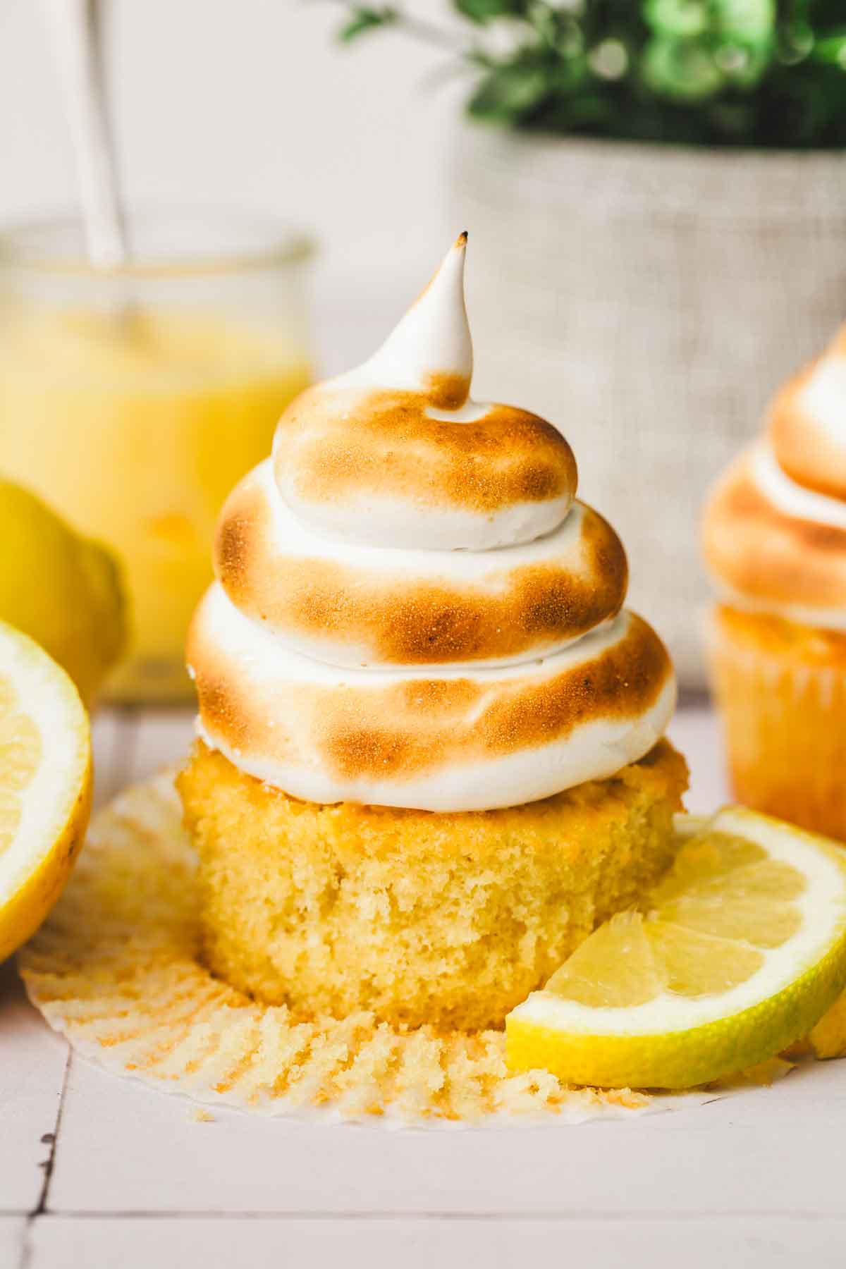 close-up of lemon meringue cupcake with golden meringue