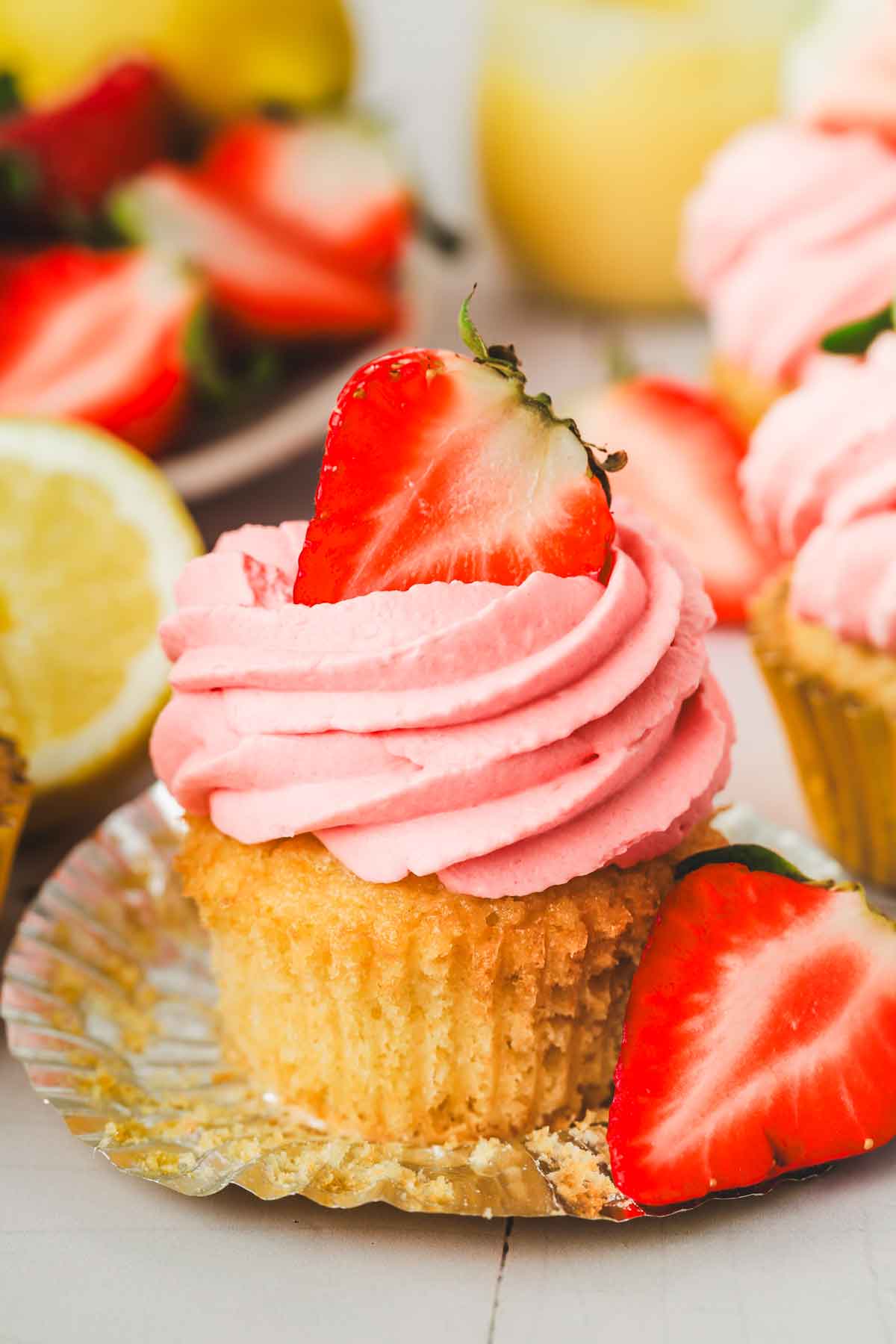 lemon strawberry cupcakes on a table