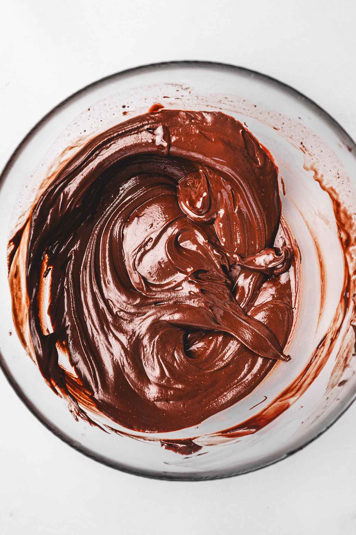 dark chocolate melted in a bowl for fudgy cookies