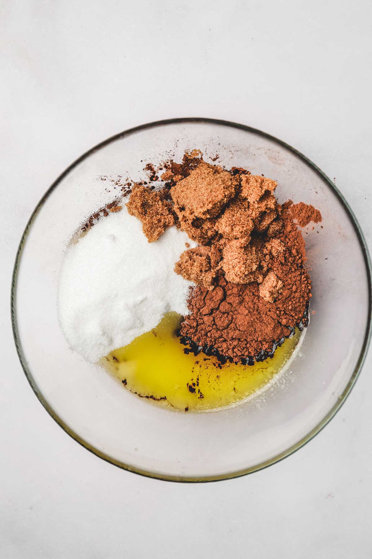 mixing bowl with sugar melted butter and cocoa powder