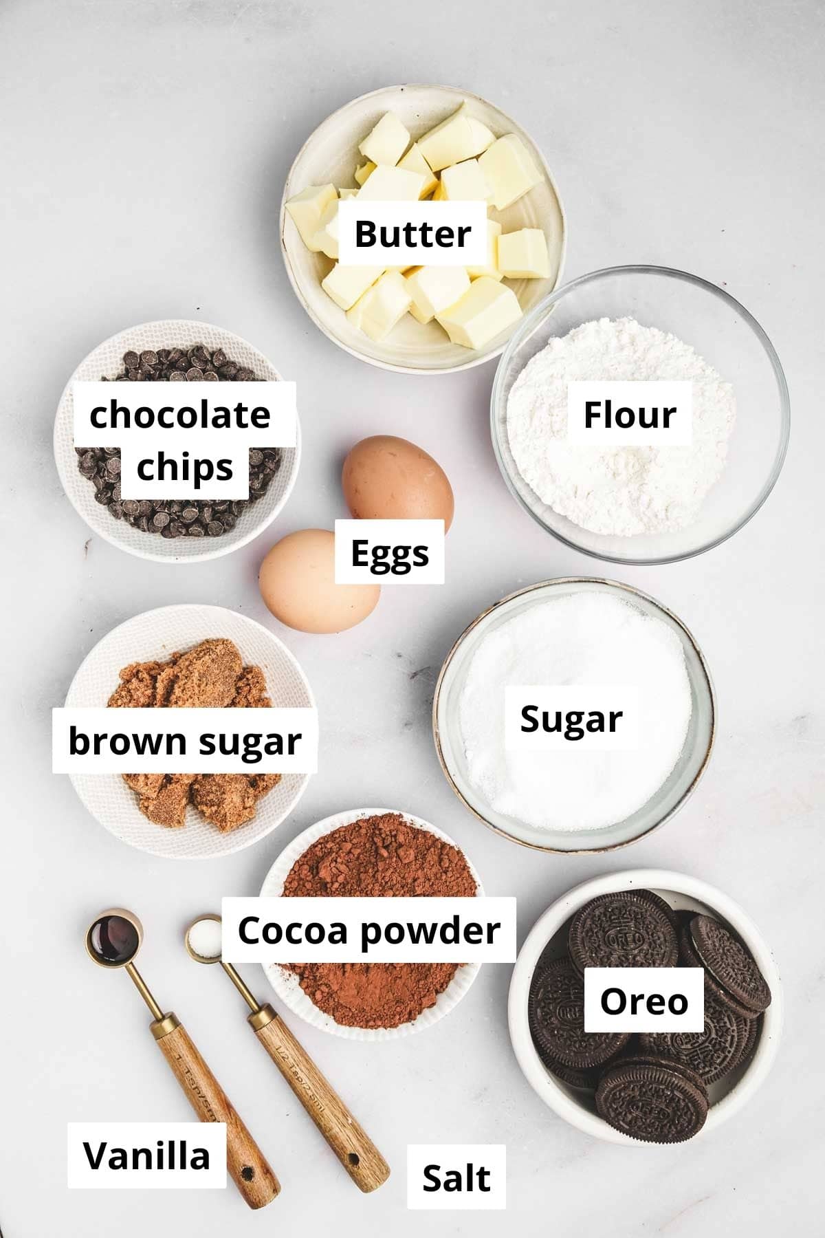 Ingredients for fudgy brownie layer and Oreo cookie dough layer in bowls