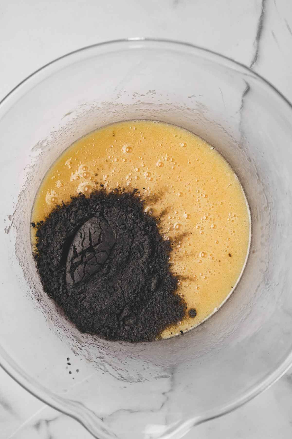 mixing bowl with egg mixture and dry ingredients