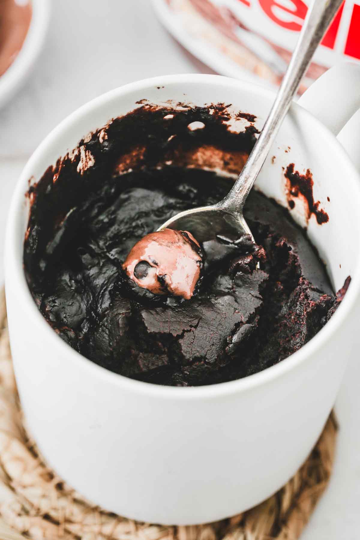 coffee mug with chocolate mug cake batter with nutella heart