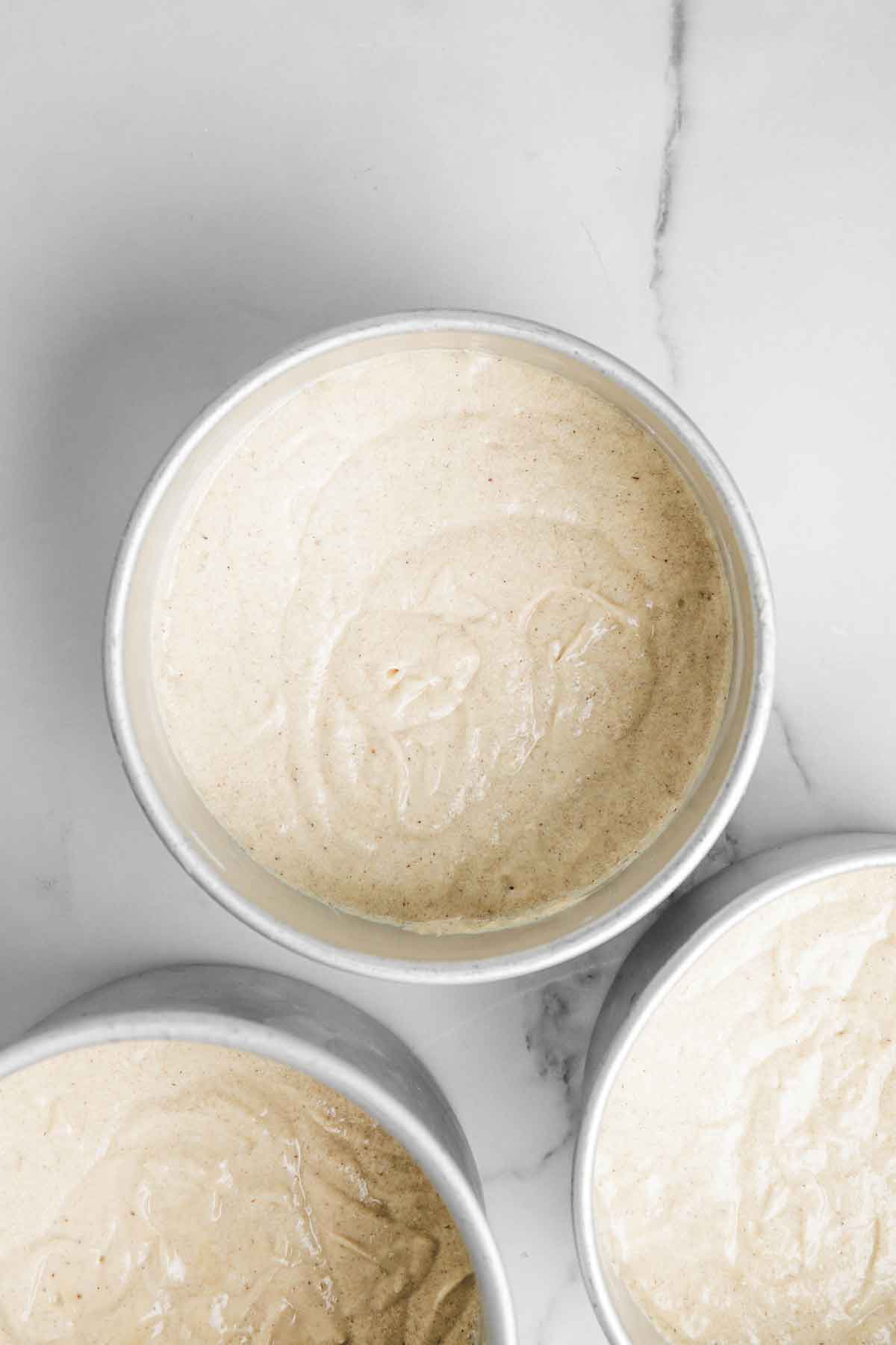 Spiced cake batter in a round baking pan