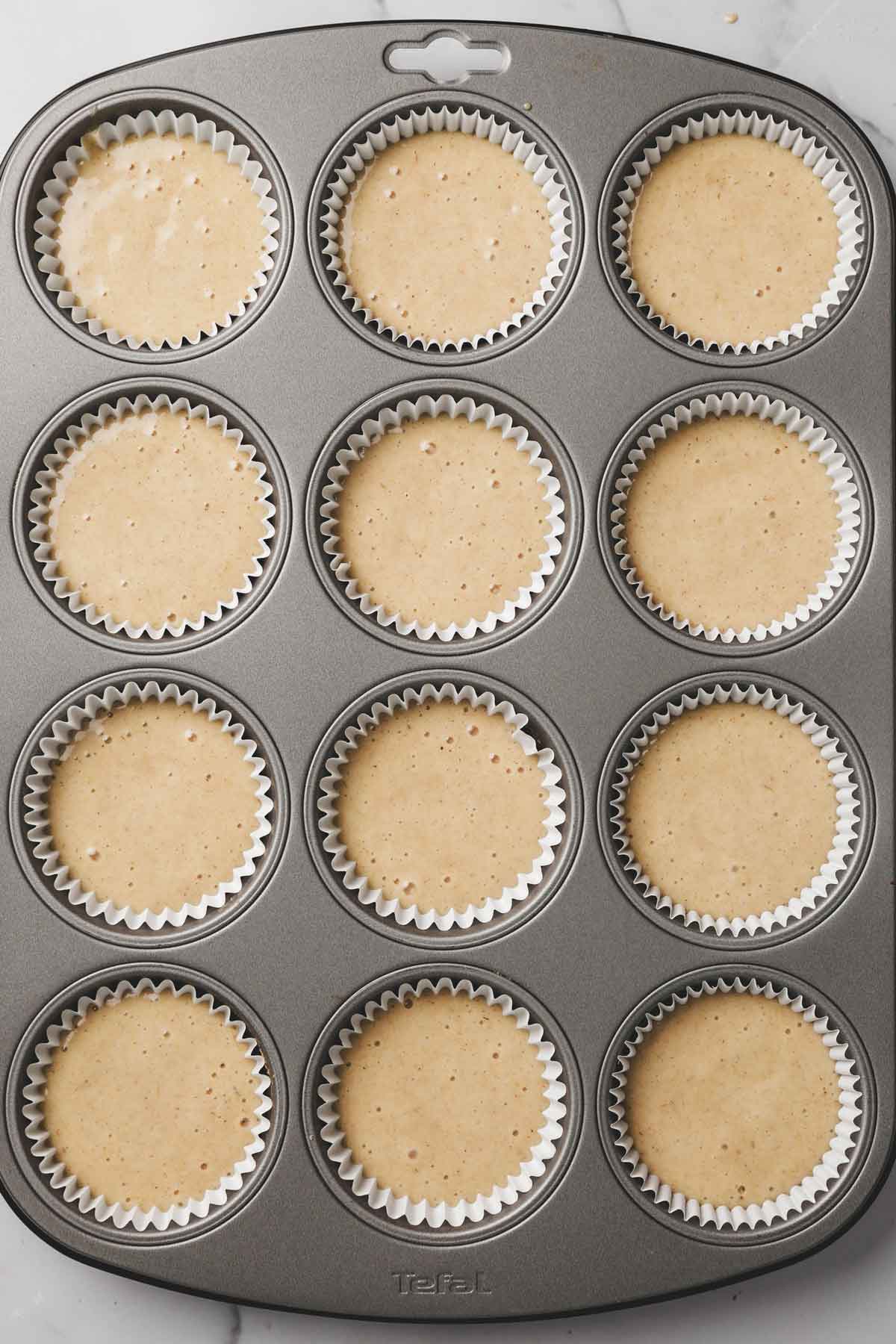 muffin tin with cupcake batter