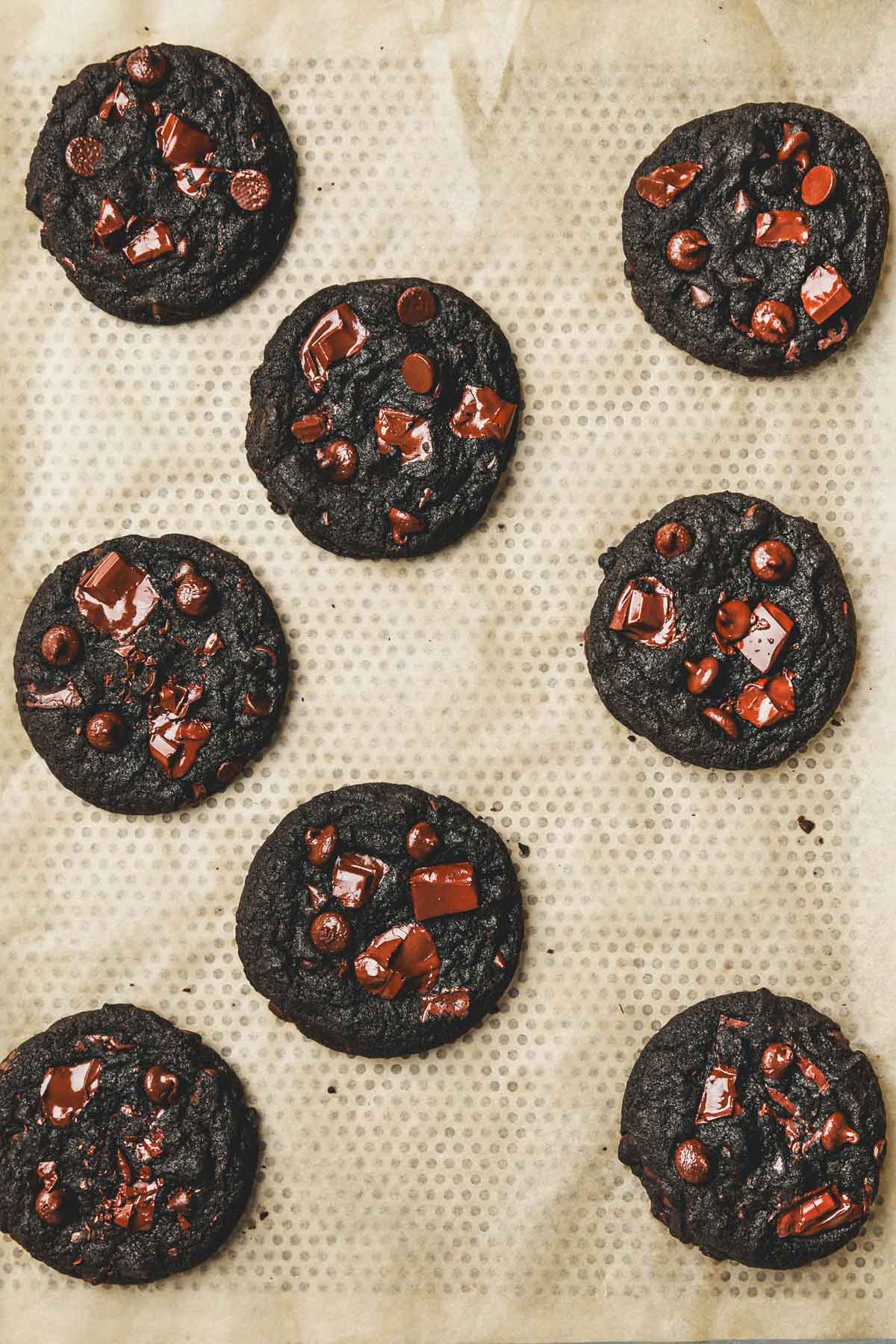 baked black cocoa cookies on a cookie sheet