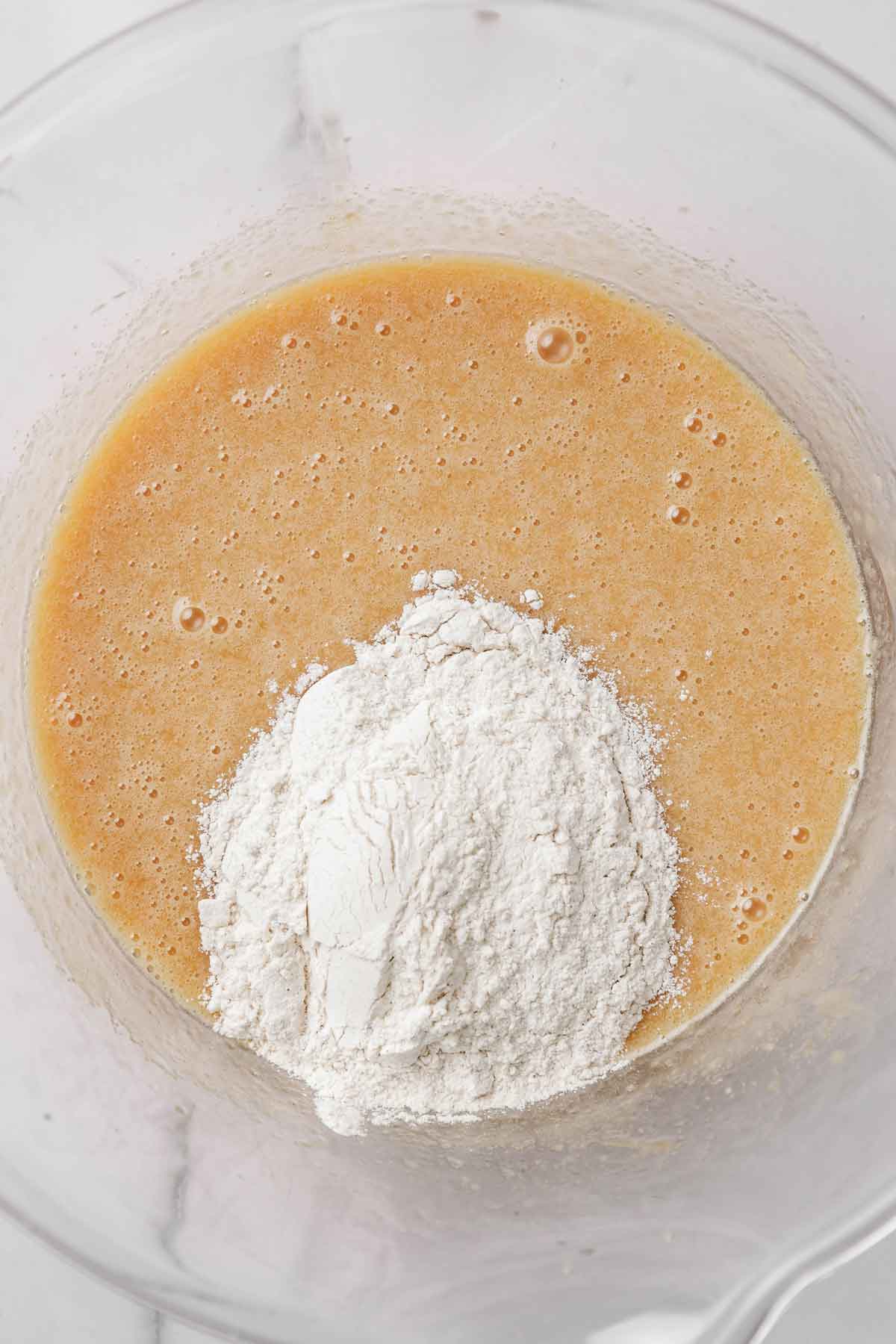 mixing bowl  with cake batter ant flour mixture