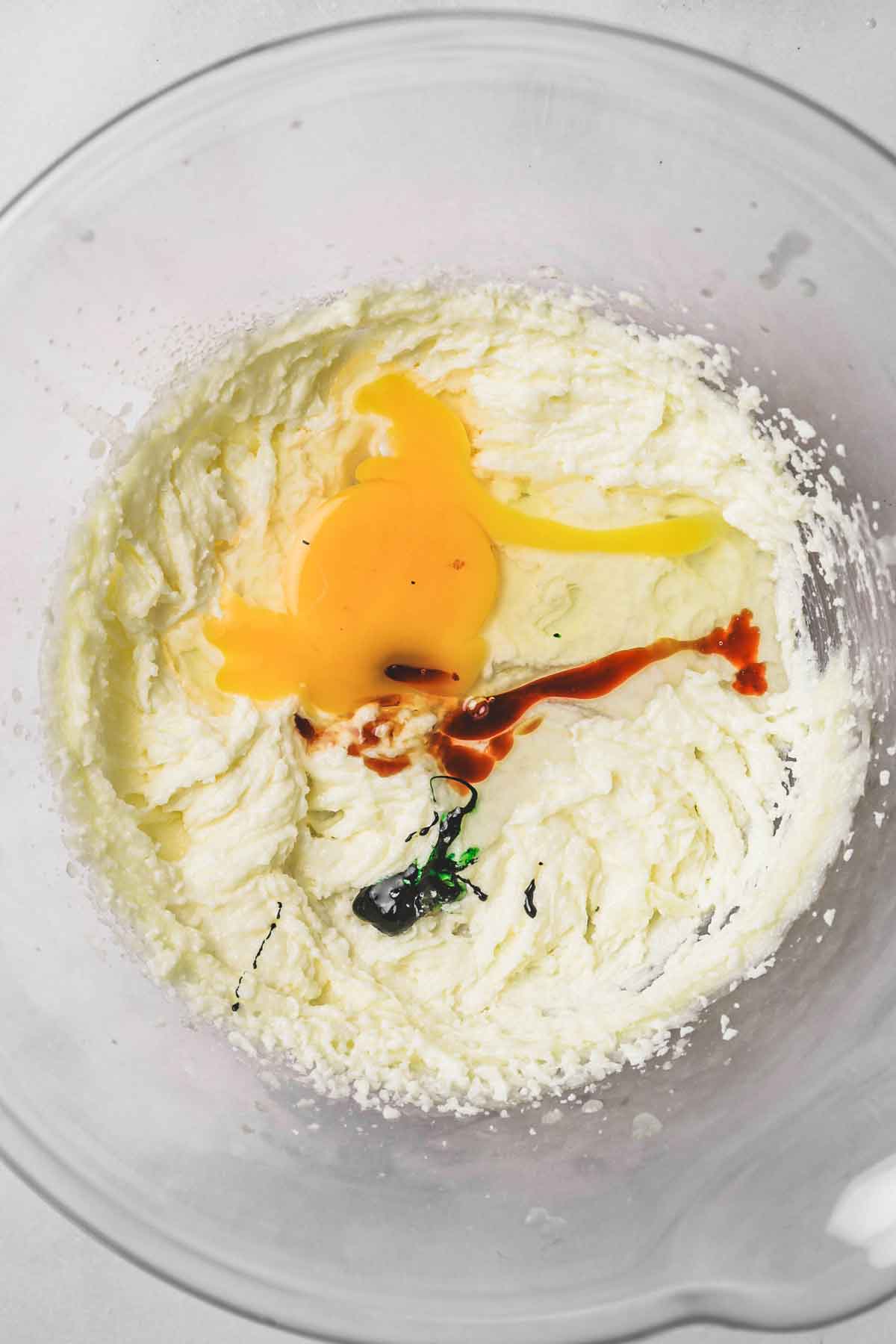 large mixing bowl with egg and butter