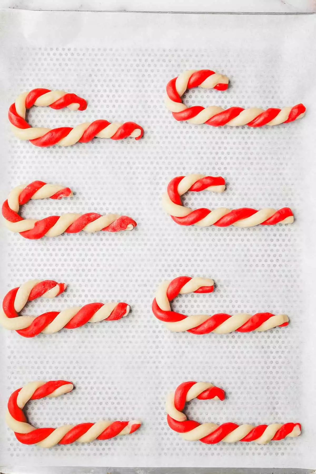 baking sheet with candy cane cookies