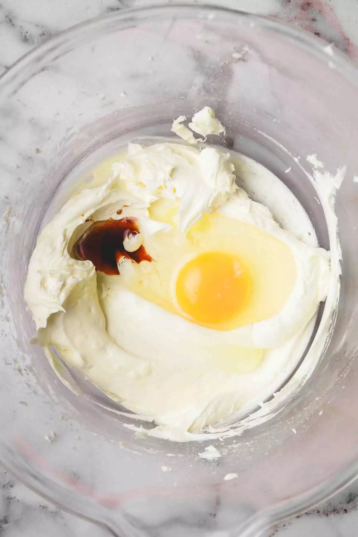 mixing bowl with egg and vanilla extract