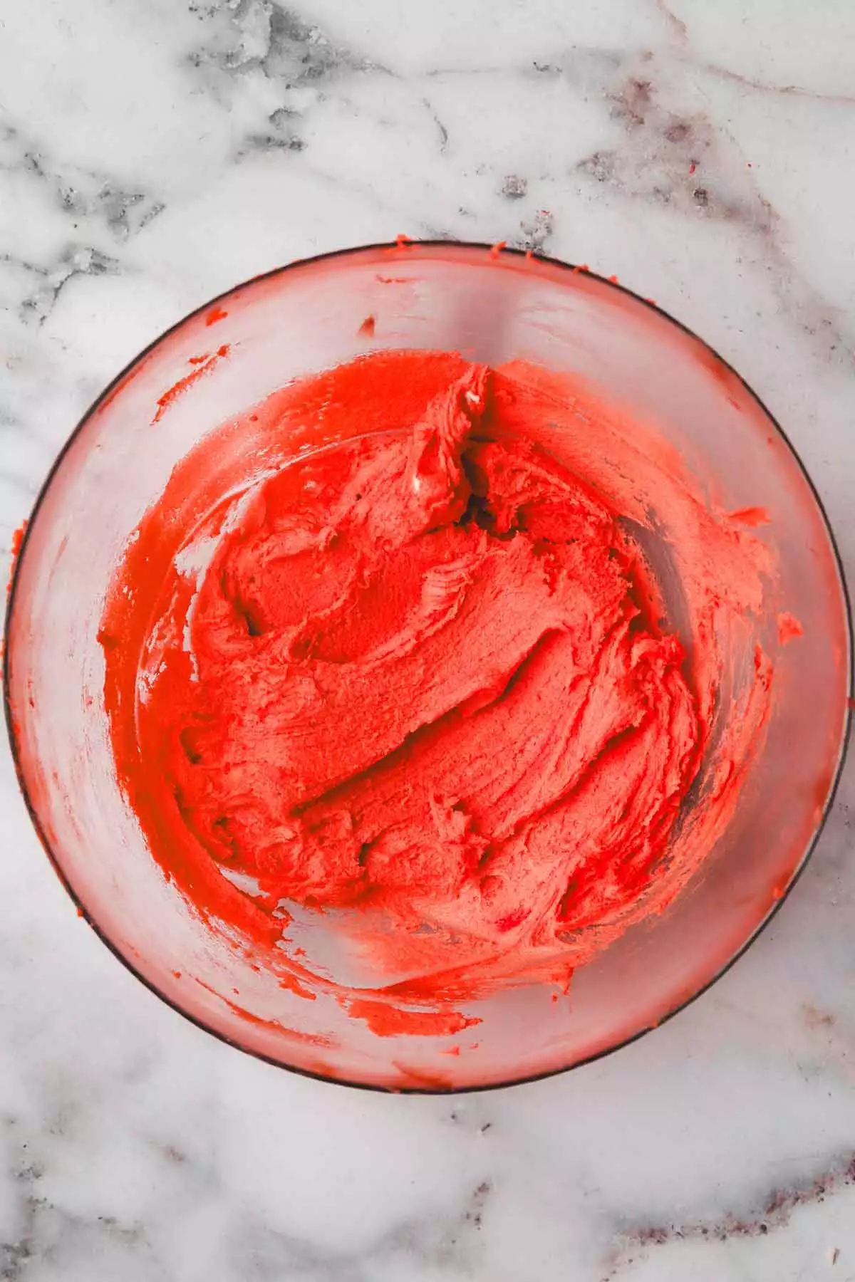 mixing bowl with red cookie dough
