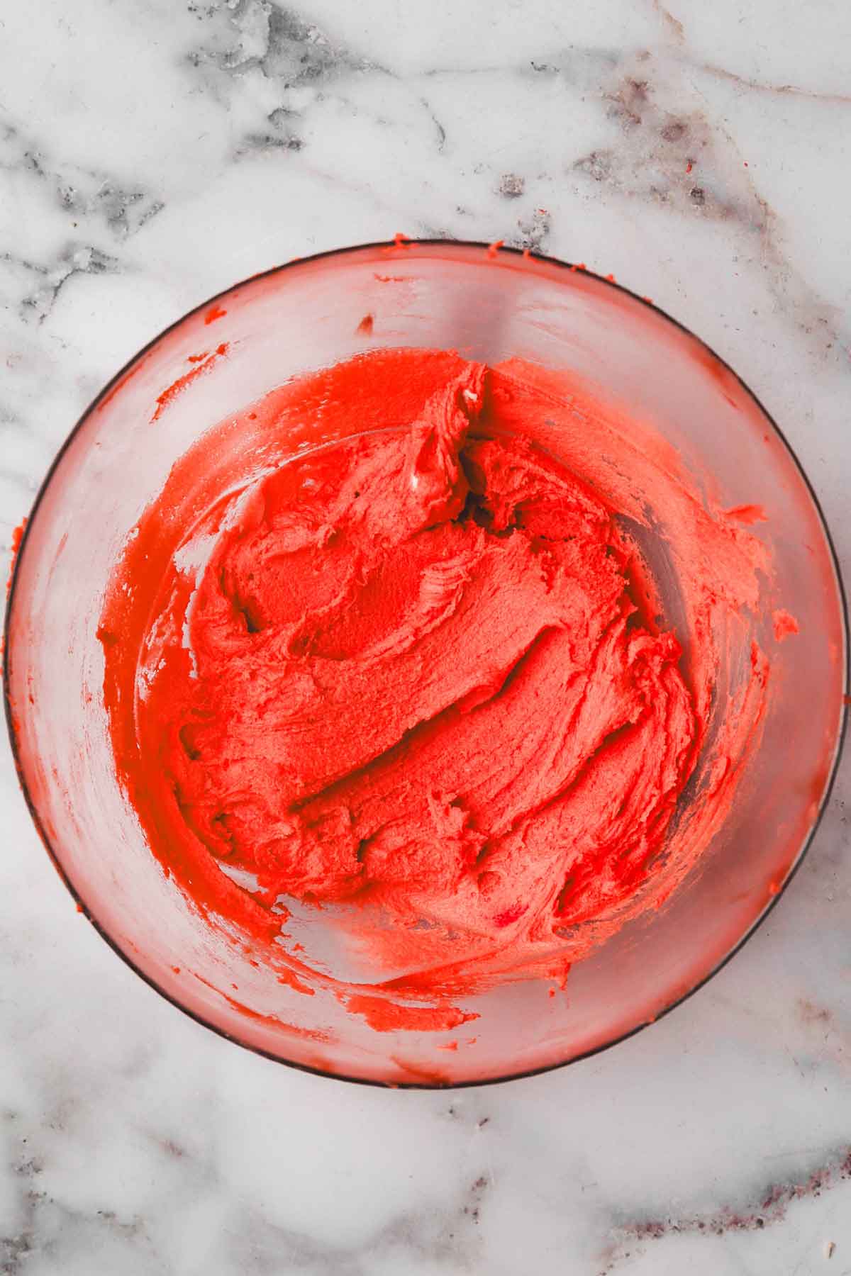 mixing bowl with red cookie dough