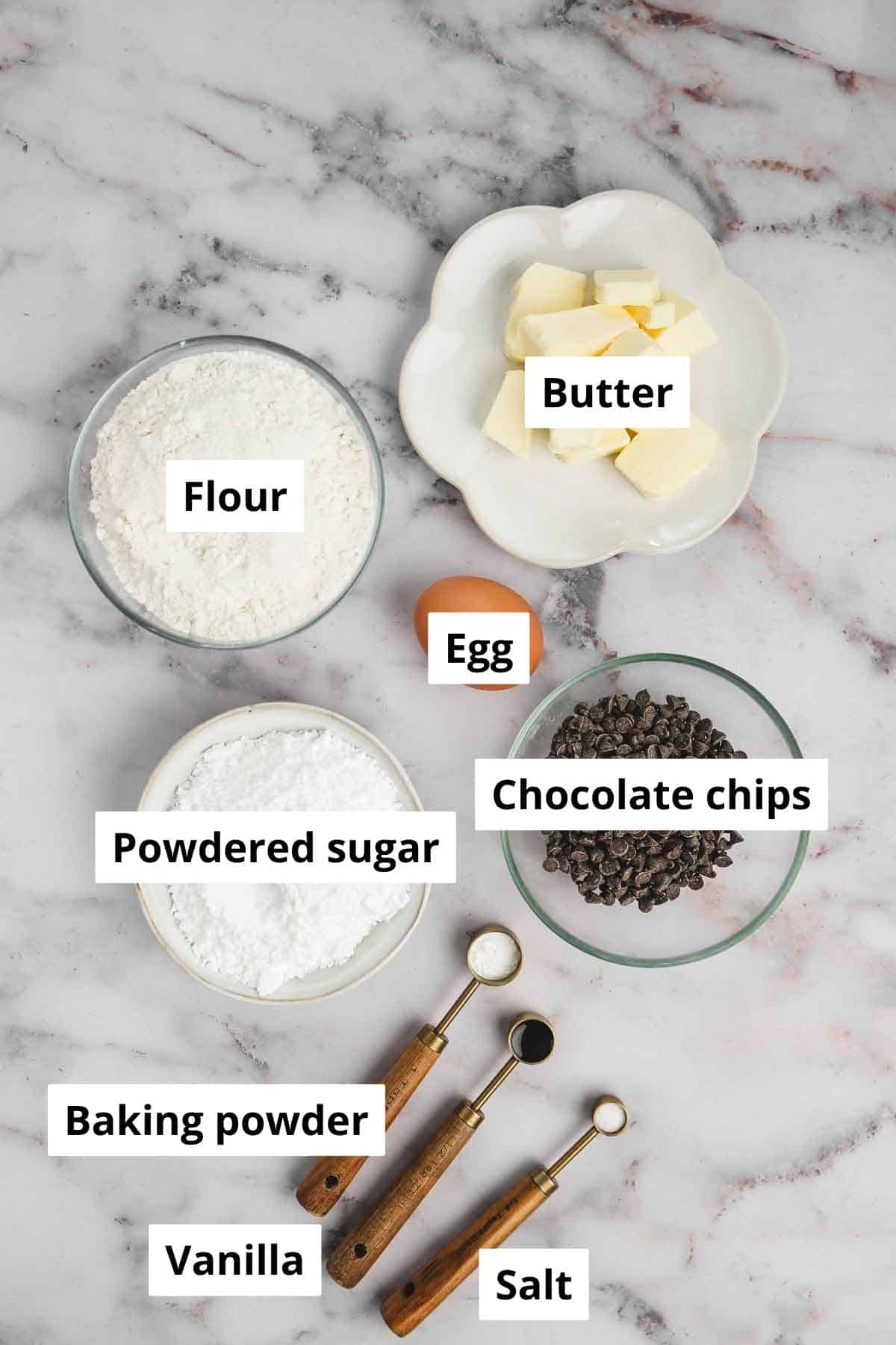 bowls with ingredient to make the chocolate chip sugar cookies