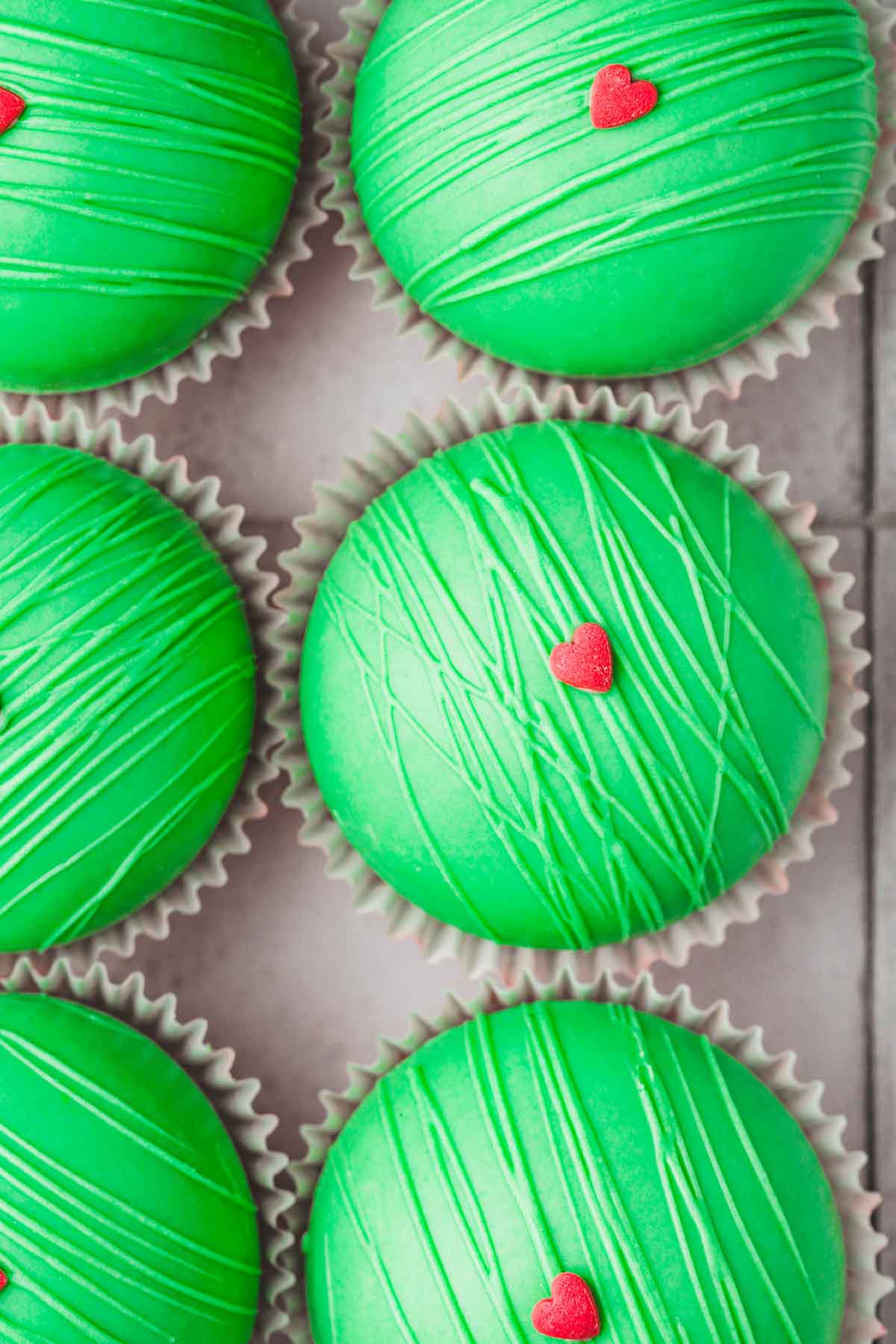 grinch hot cocoa bombs on a table