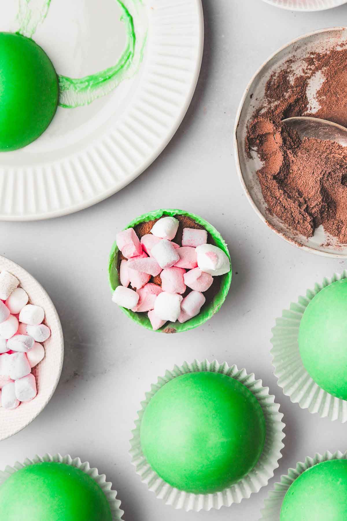 half sphere with marshmallow and hot cocoa mix