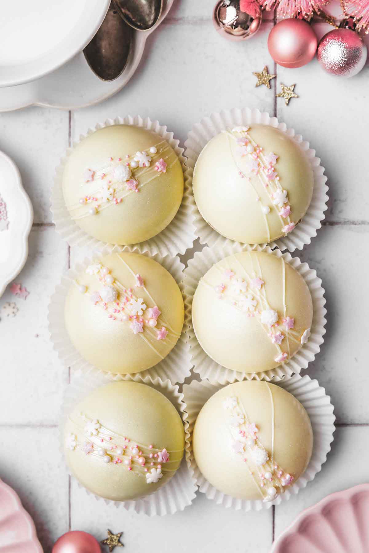 white hot chocolate bombs on a table