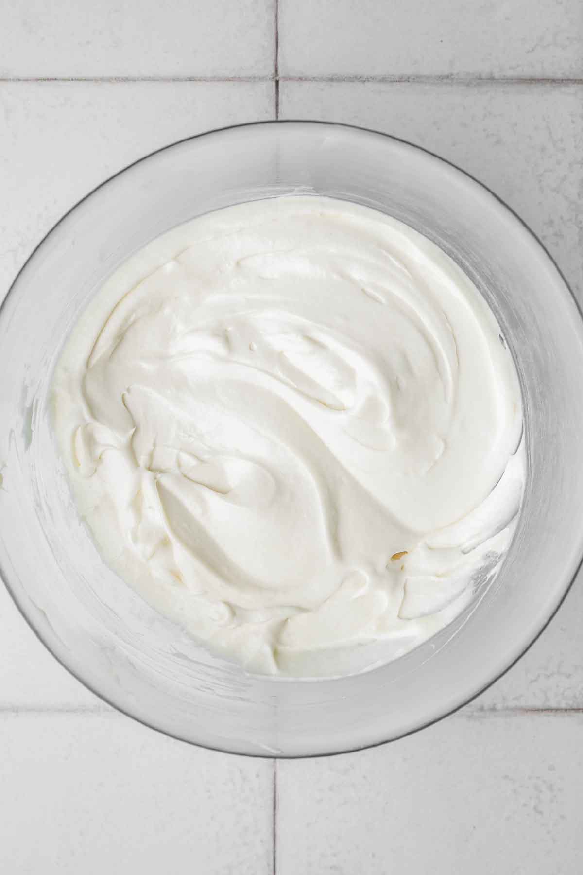 medium bowl with cream cheese frosting mixture