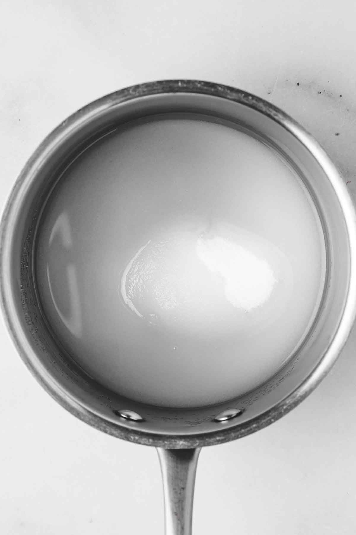 small saucepan with sugar and water
