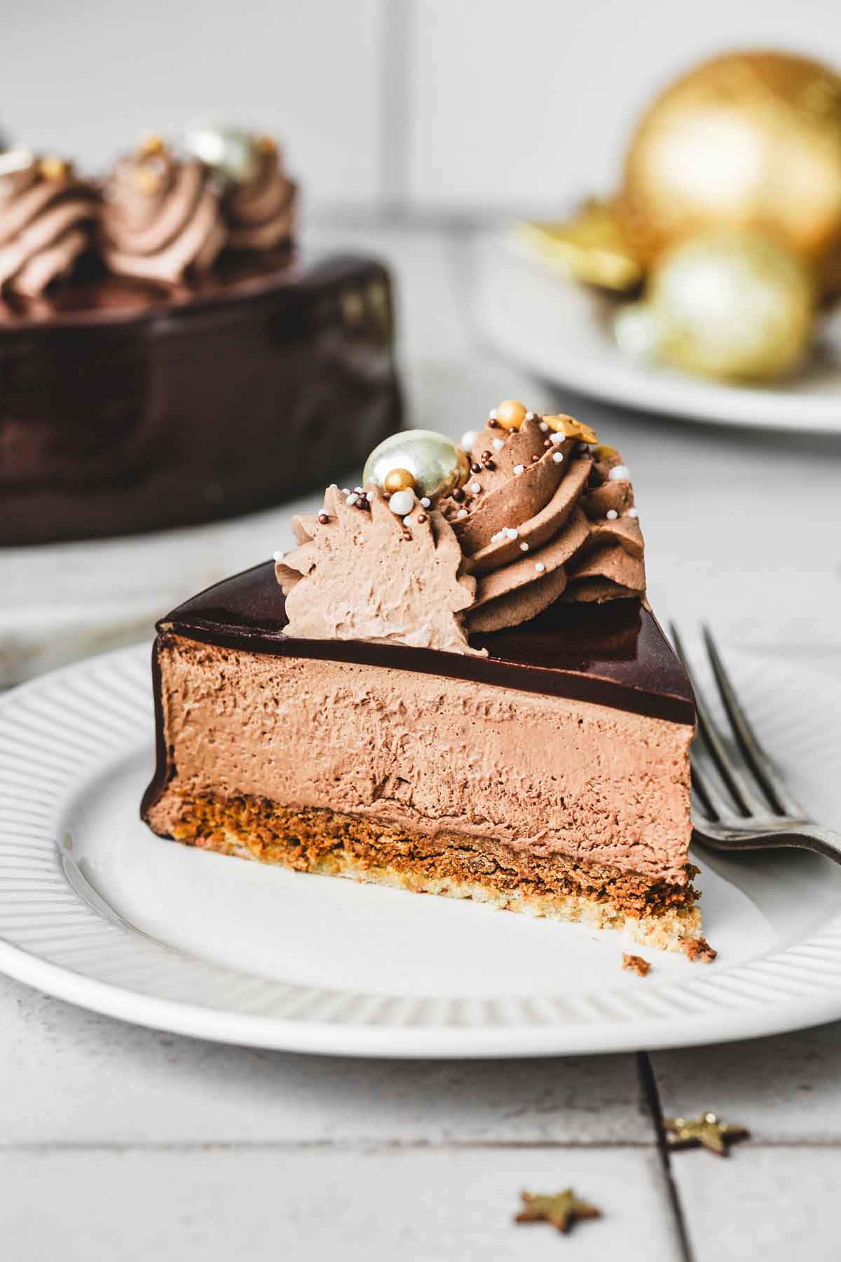 sliced chocolate mirror cake on a plate