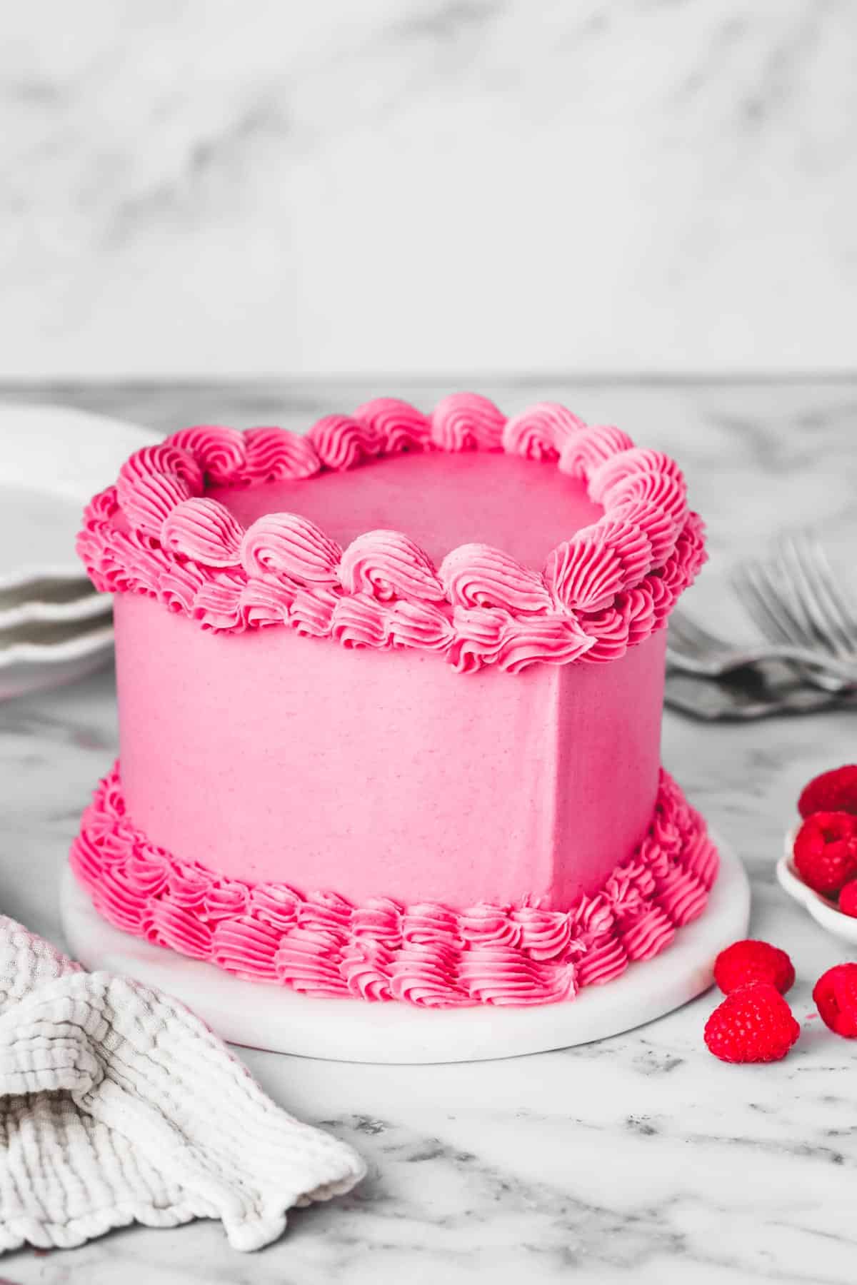 raspberry pink heart vintage cake on a table