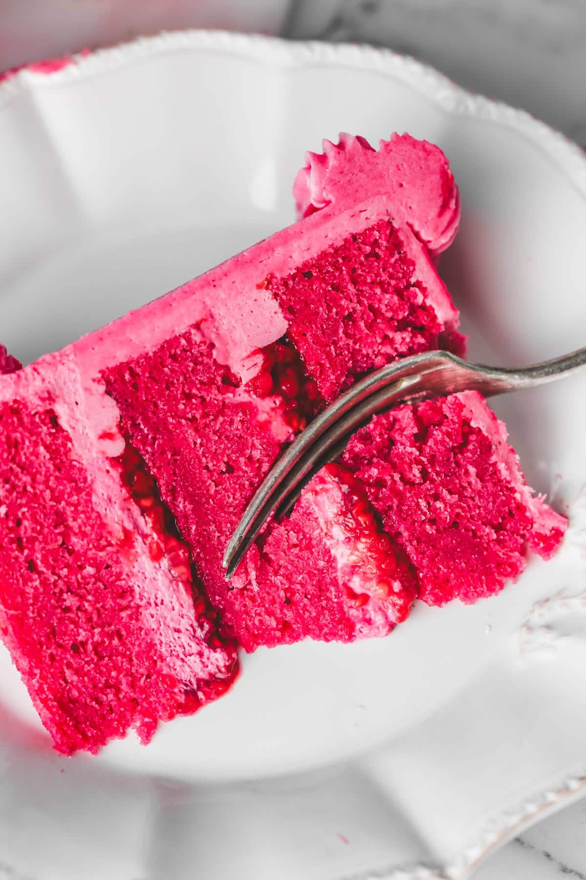 sliced raspberry cake on a plate