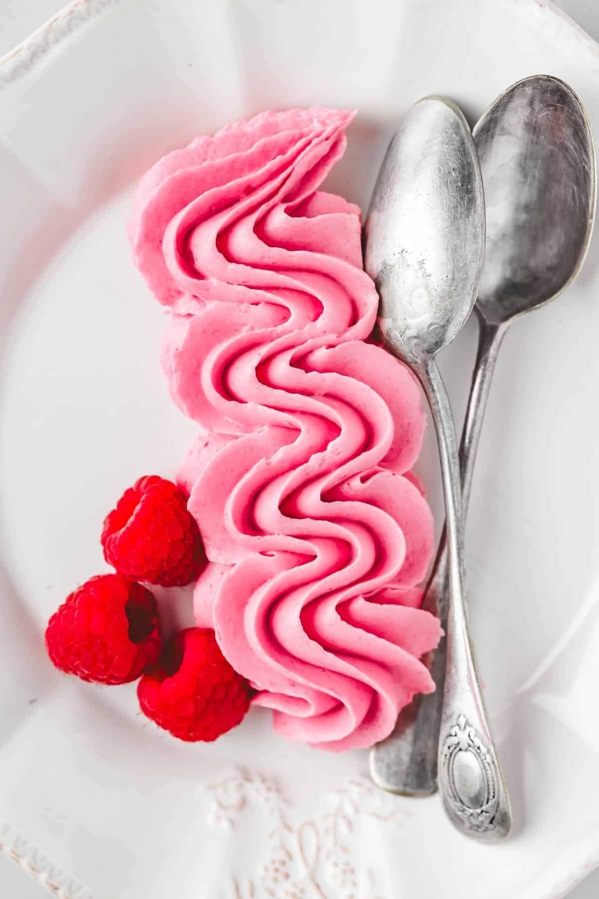 pipped raspberry buttercream on a plate