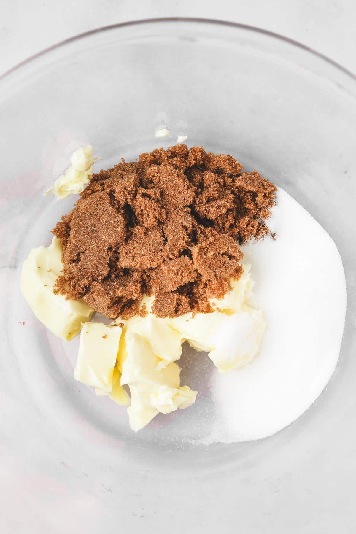 large bowl with butter and white sugar and brown sugar