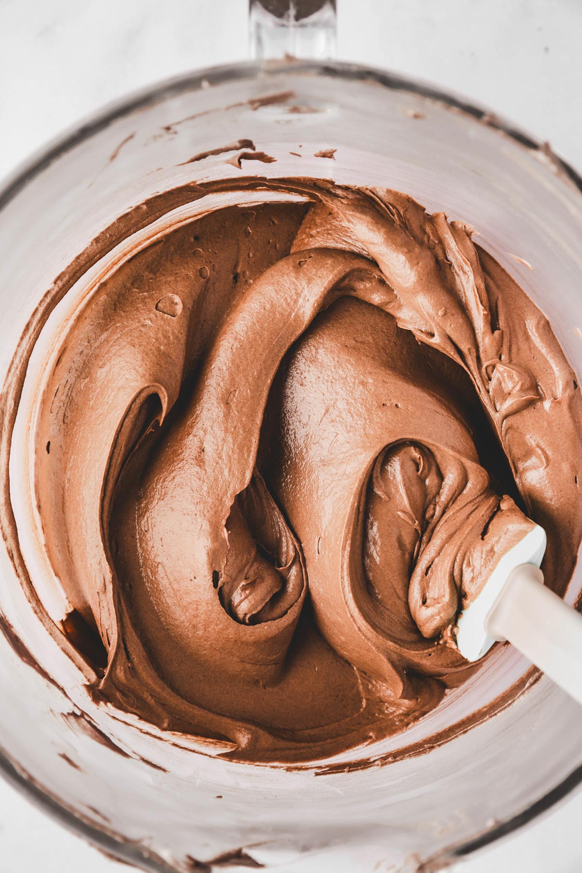 mixing bowl with chocolate frosting