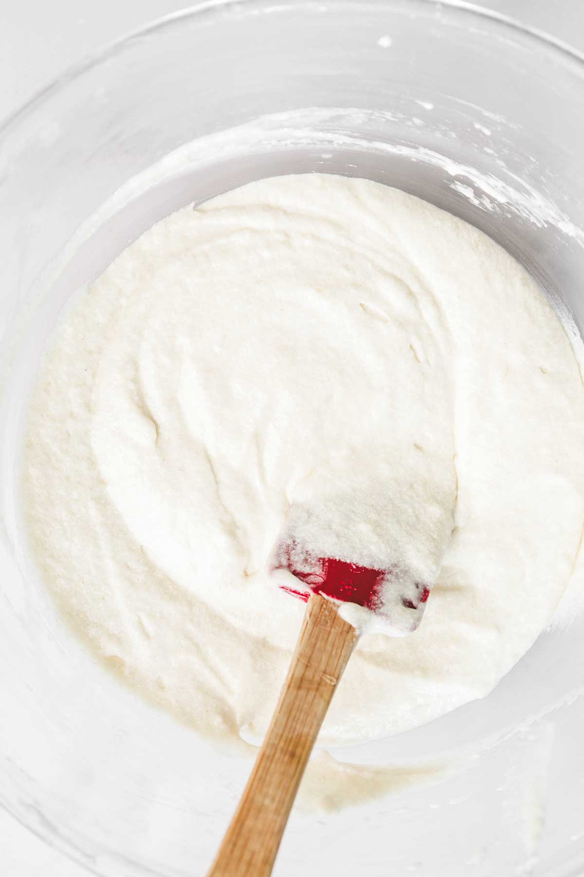 large mixing bowl with vanilla cupcakes batter