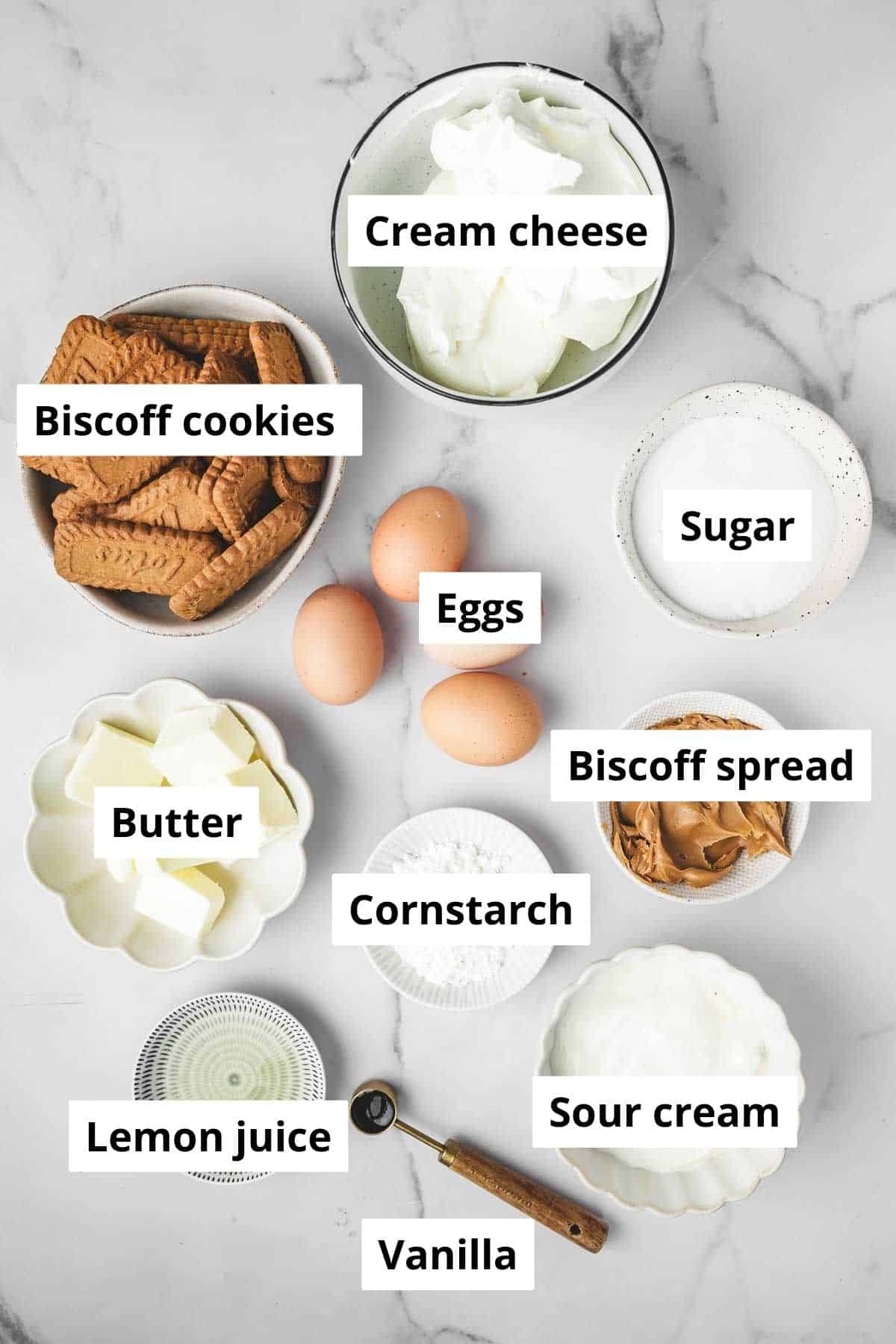 Bowls with ingredients to make a Biscoff cheesecake