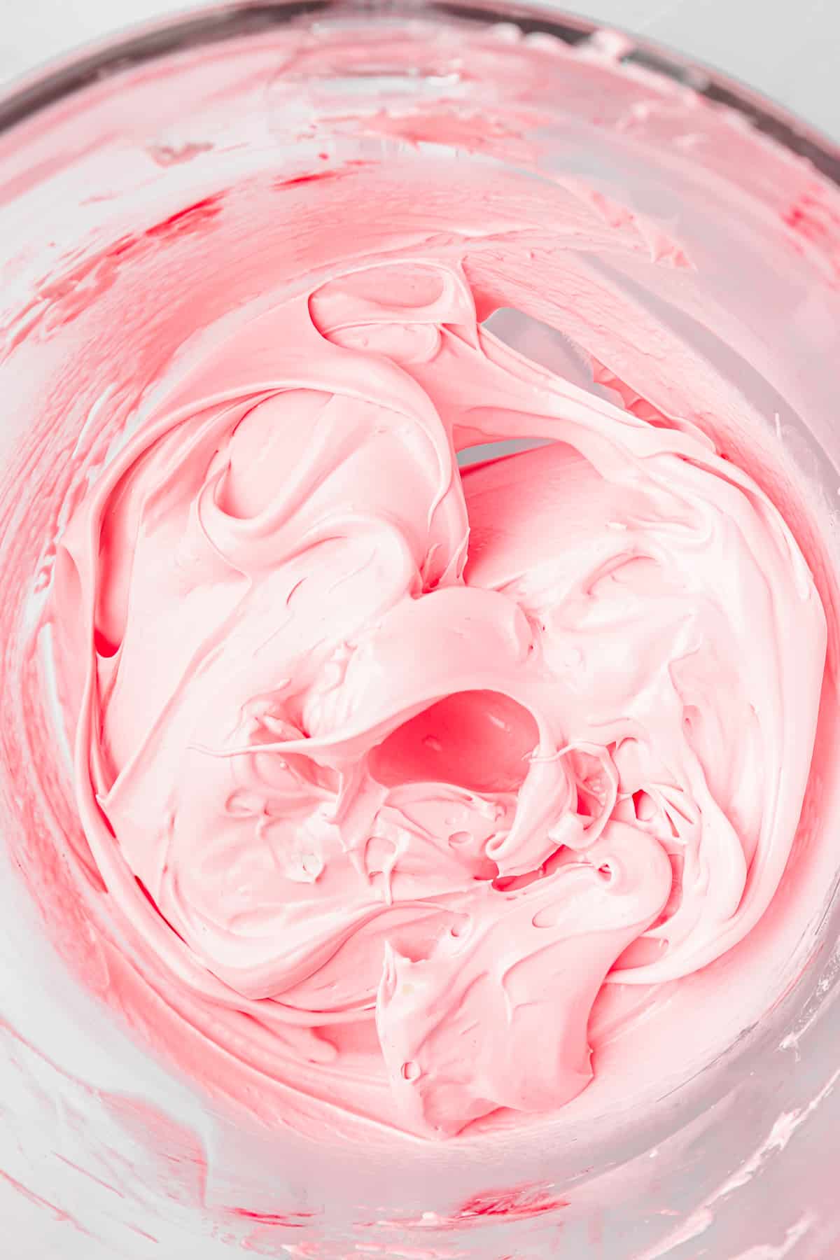 large mixing bowl with pink french meringue