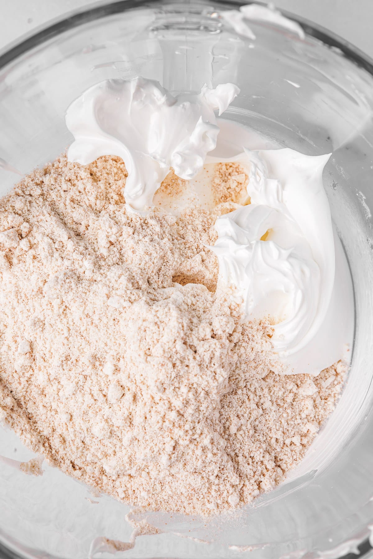 large bowl with meringue and almond mixture