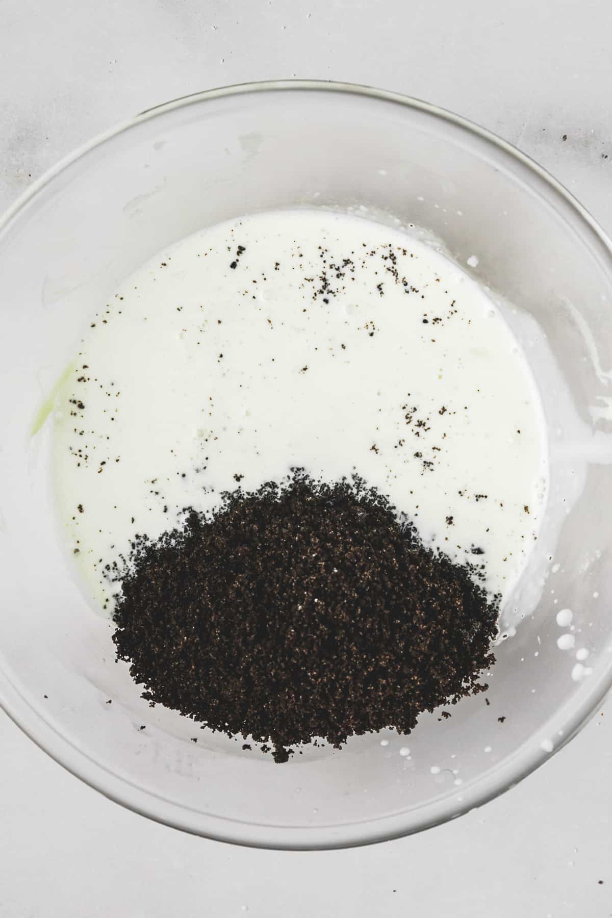 bowl with Oreo ganache made from heavy cream and crushed Oreos