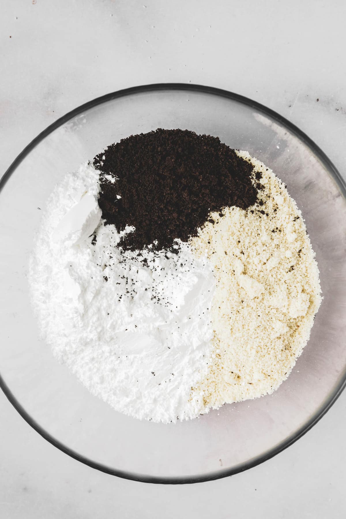 small bowl with almond flour and sugar for Oreo macarons