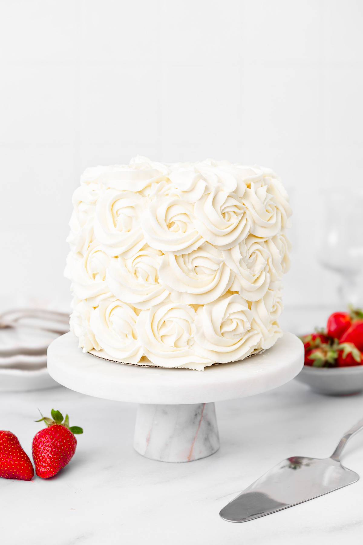 elegant mascarpone rose cake on a cake stand