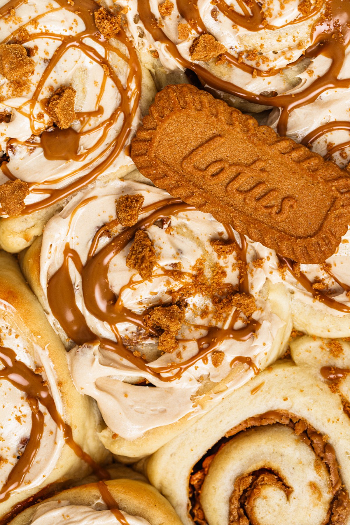 Soft Biscoff rolls topped with cookie butter cream cheese glaze