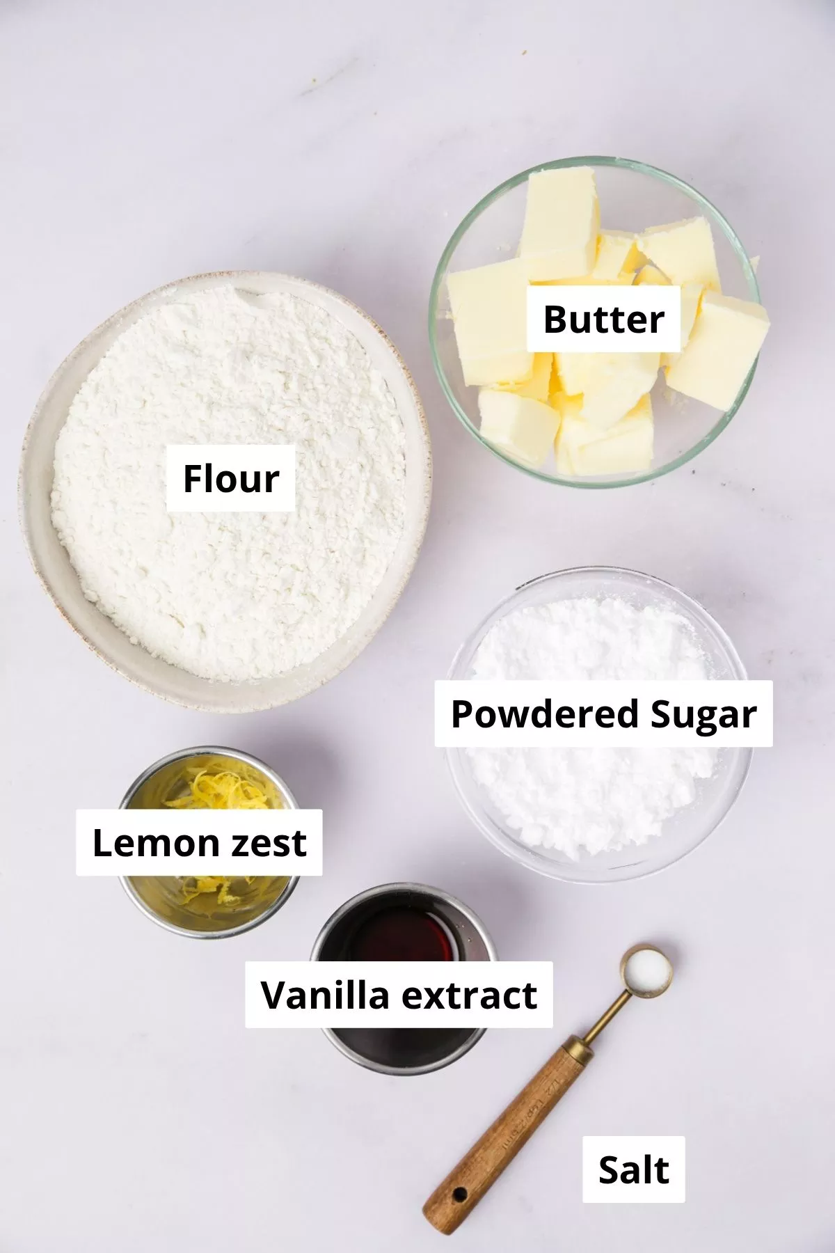 ingredients for lemon meringue pie cookies including butter, eggs, lemon curd, and sugar