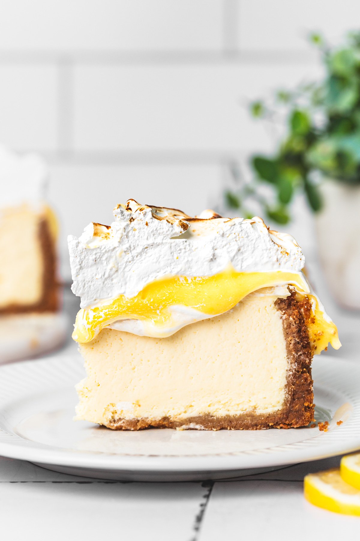 slice of cheesecake with a buttery graham cracker crust
