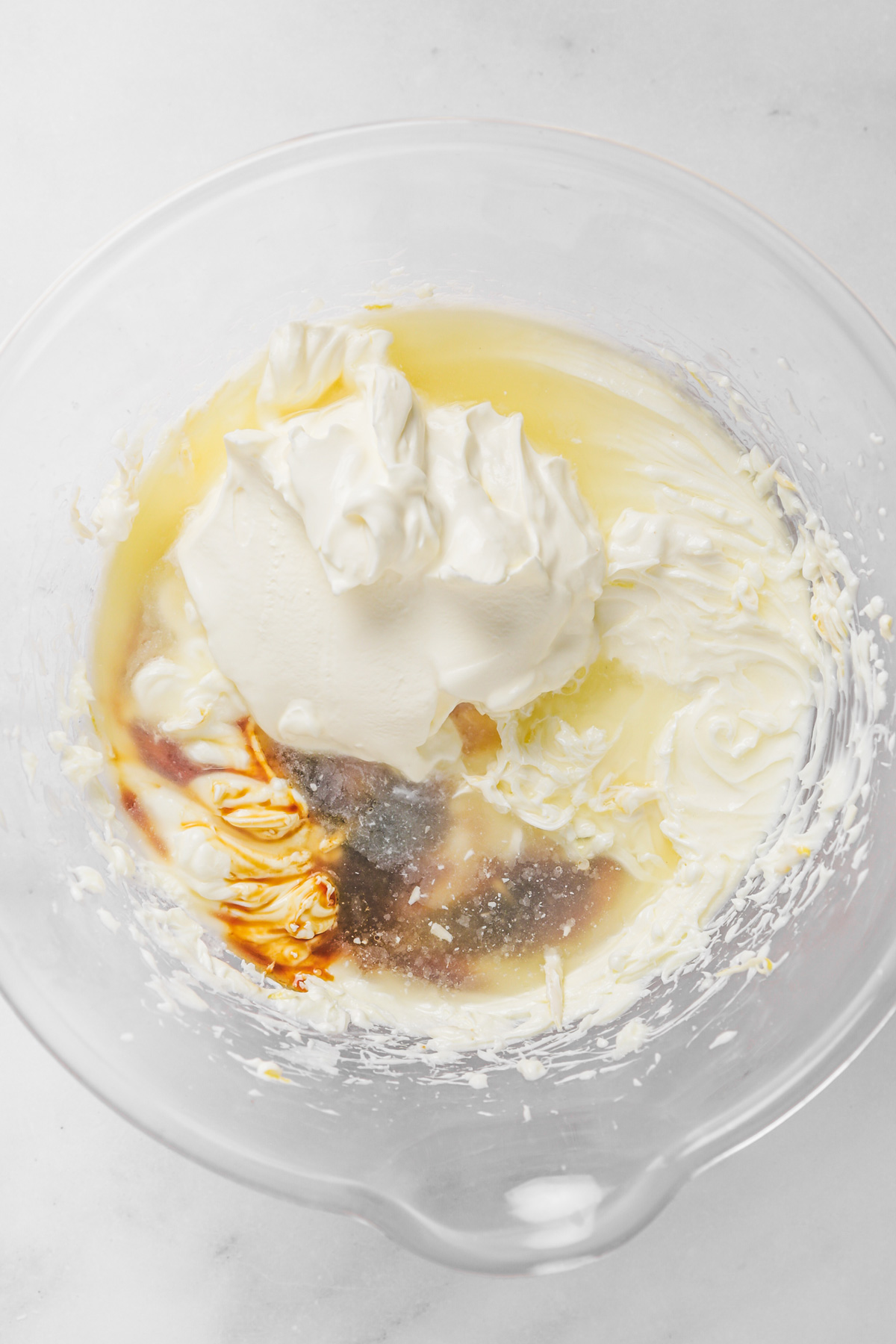large mixing bowl with lemon juice and cream cheese mixture