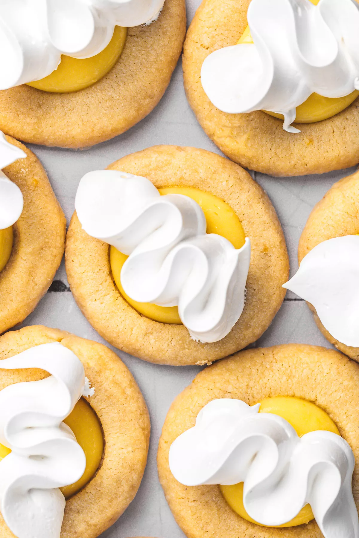 piping toasted meringue on lemon curd cookies