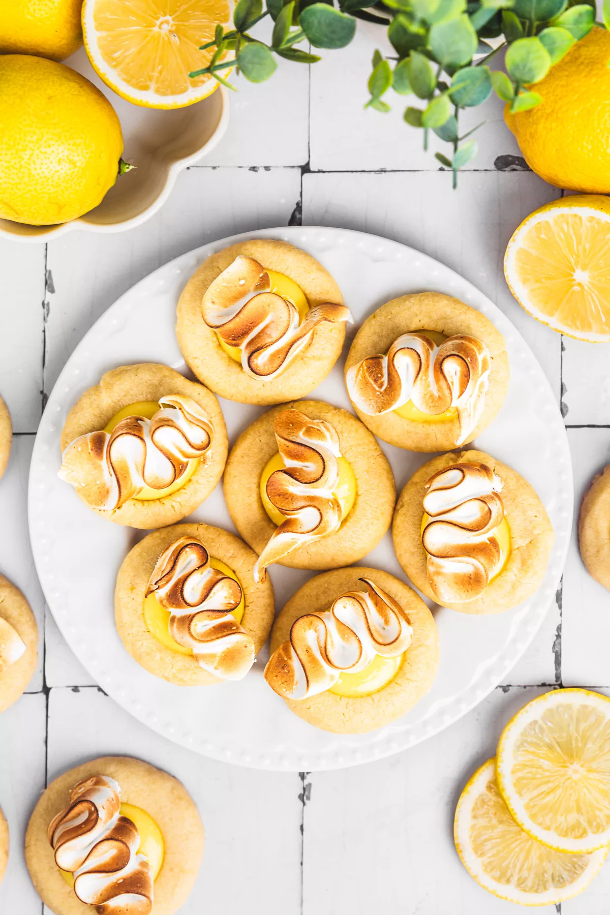 lemon meringue cookies with lemon curd and toasted meringue on a plate